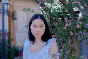Lily Wang, a bio photo portrait.