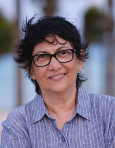 Shani Mootoo, a photo portrait in glasses.